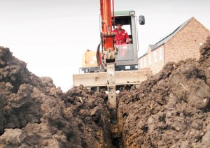Digging a drainage trench