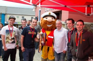 The 2014 winning team – Ward Automation are presented with the perpetual cup by the RNLI’s Stormy Stan and Press Officer Shane Smyth – Photo Linburn Photography